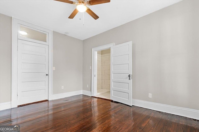 spare room with hardwood / wood-style flooring and ceiling fan