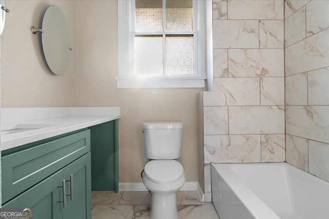 full bathroom featuring vanity, tiled shower / bath, and toilet