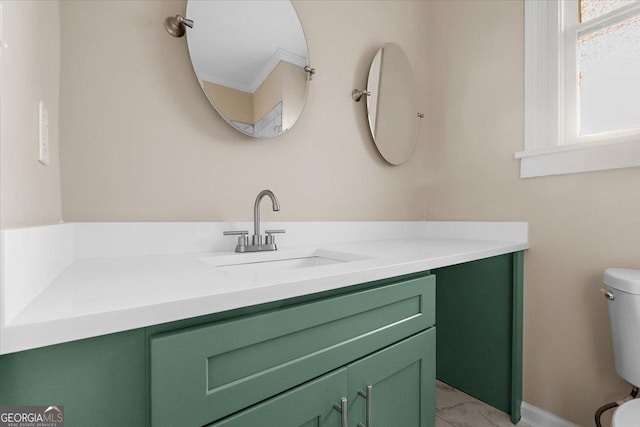 bathroom featuring vanity and toilet