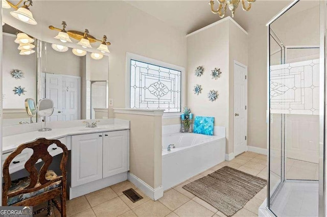 bathroom with tile patterned floors, separate shower and tub, and vanity