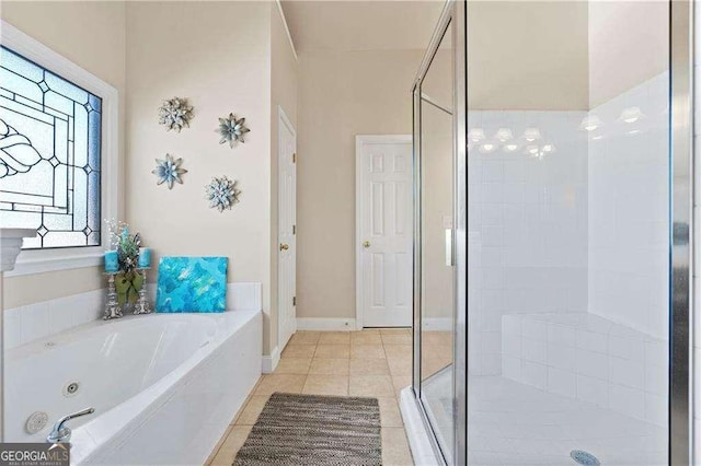 bathroom with tile patterned floors and separate shower and tub