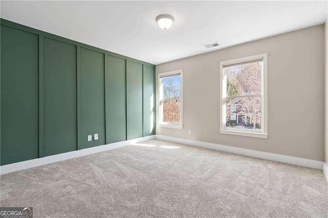 unfurnished bedroom with a closet and light carpet