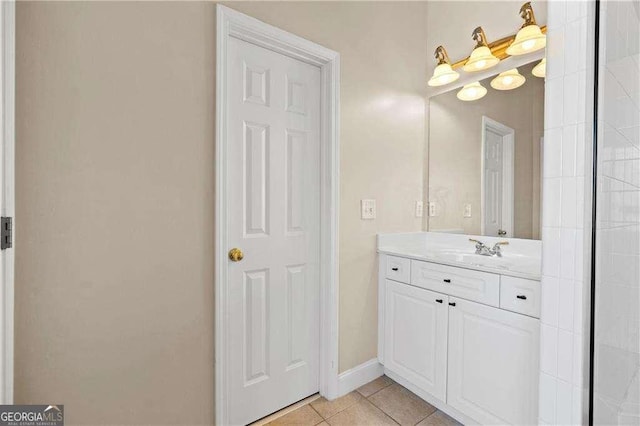 bathroom featuring tile patterned flooring and vanity