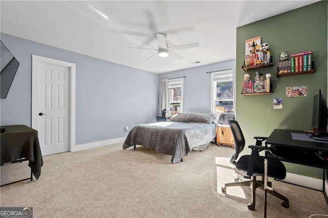 bedroom with light carpet and ceiling fan