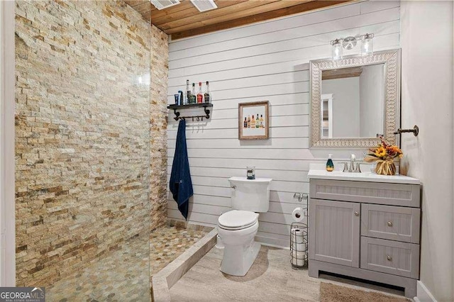 bathroom with vanity, toilet, and wooden ceiling