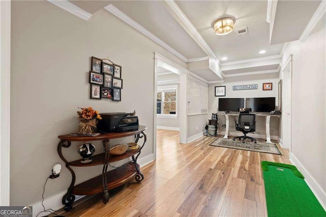 home office featuring ornamental molding and light wood-type flooring