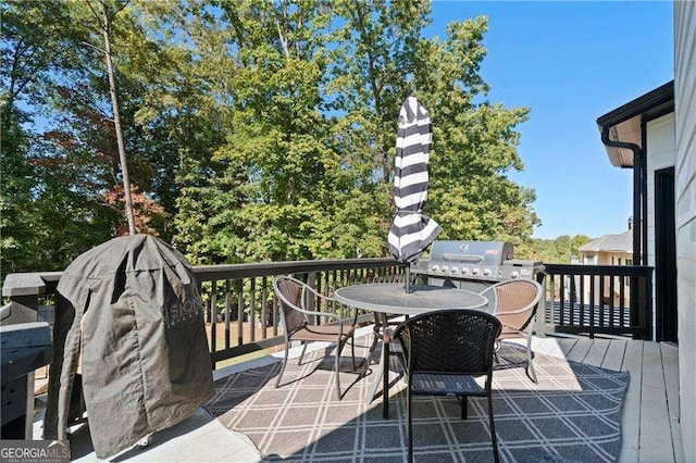 wooden deck featuring grilling area