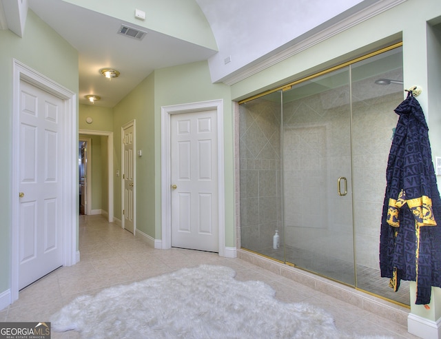 tiled bedroom featuring a closet