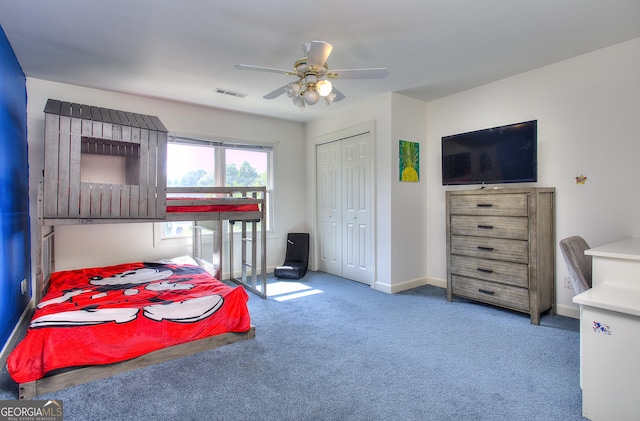 bedroom featuring carpet flooring, ceiling fan, and a closet