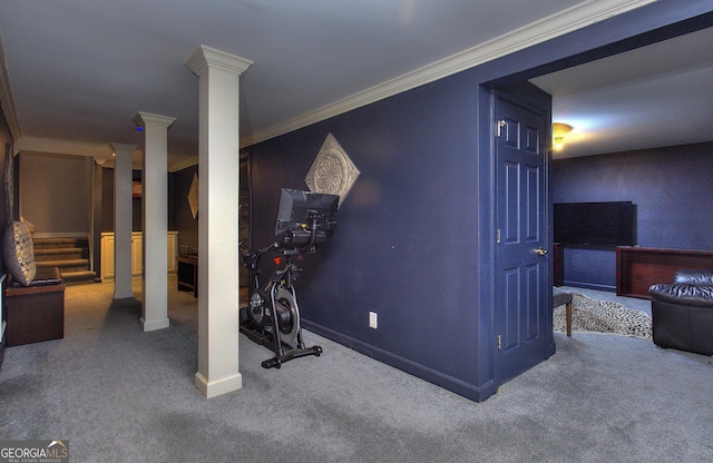 exercise room featuring ornate columns, crown molding, and carpet