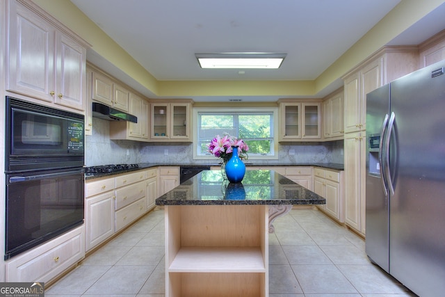 kitchen with decorative backsplash, black appliances, a center island, and light tile patterned flooring