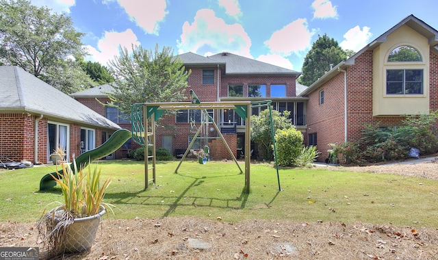 exterior space featuring a playground and a front lawn