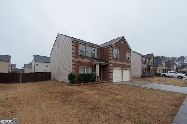 view of front of house with a garage and a front lawn