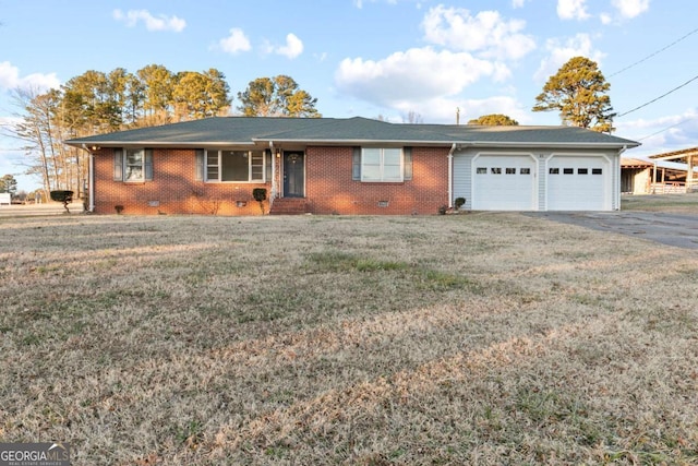 single story home with a garage and a front lawn