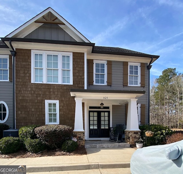 view of front of property featuring central AC unit and french doors