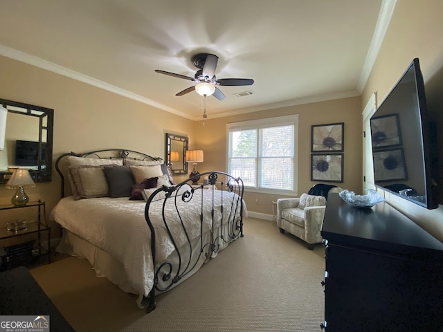 carpeted bedroom with crown molding and ceiling fan