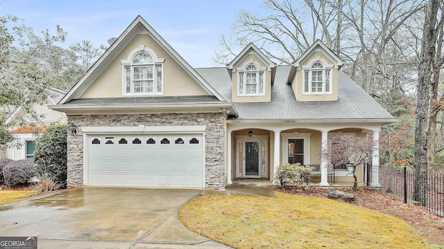 view of front of home with a porch and a garage