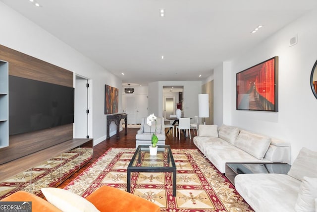 living room with dark hardwood / wood-style flooring