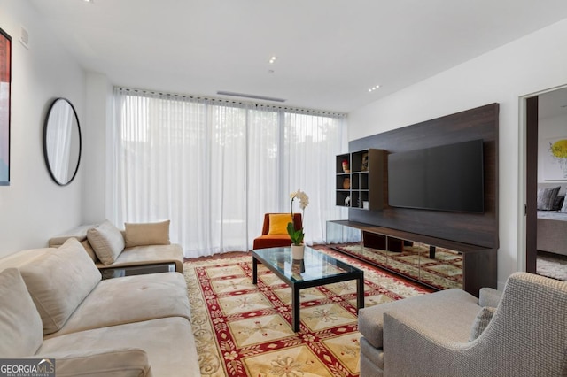 living room featuring a wealth of natural light and expansive windows