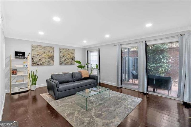 living area featuring ornamental molding, recessed lighting, baseboards, and hardwood / wood-style flooring