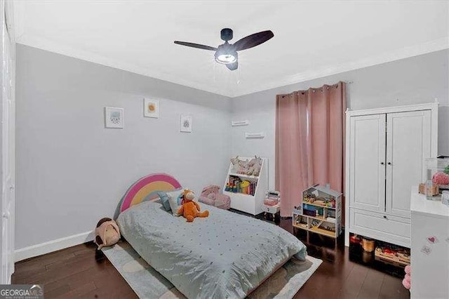 bedroom with a ceiling fan, wood-type flooring, and baseboards