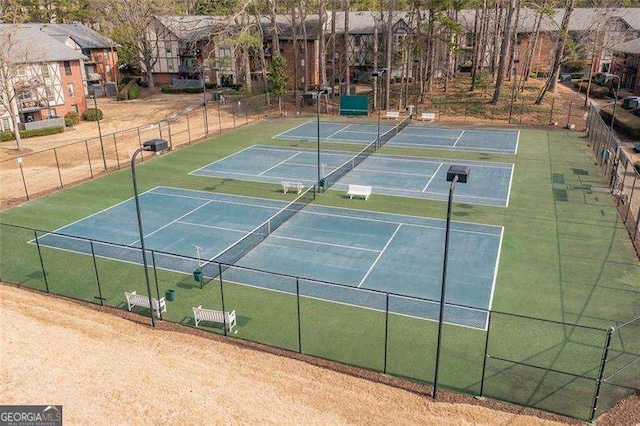 view of tennis court with fence