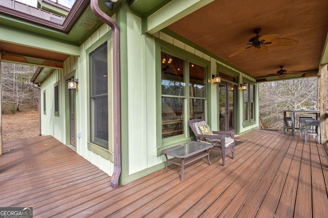 wooden terrace featuring ceiling fan