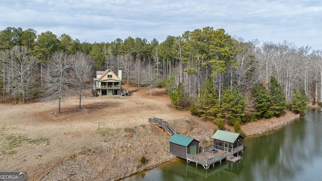 birds eye view of property with a water view