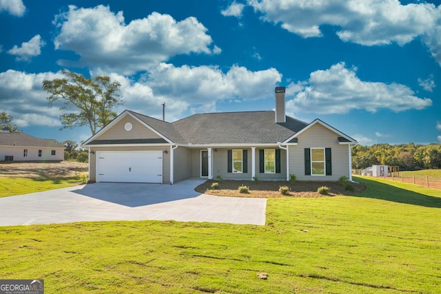 ranch-style home featuring a garage and a front yard