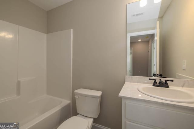 full bathroom with vanity, bathing tub / shower combination, and toilet