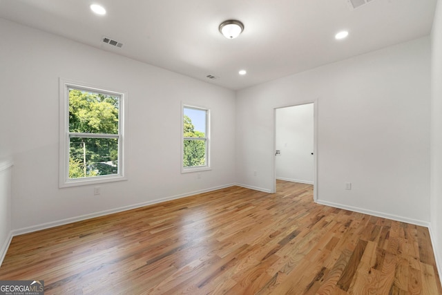 unfurnished room with light hardwood / wood-style floors