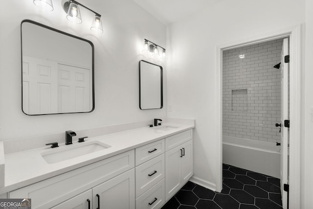 bathroom featuring vanity, tile patterned floors, and tiled shower / bath