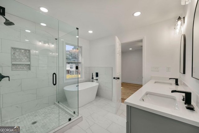 bathroom featuring vanity and plus walk in shower