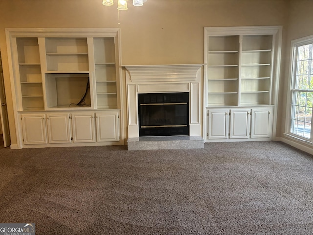 unfurnished living room featuring light colored carpet