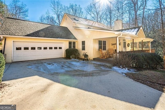 view of front of home featuring a garage and covered porch