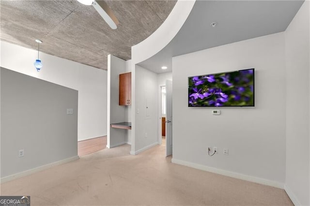 unfurnished living room featuring carpet floors