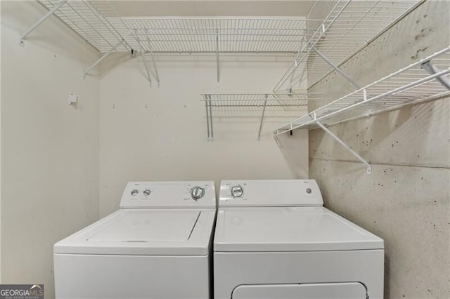 laundry room with separate washer and dryer