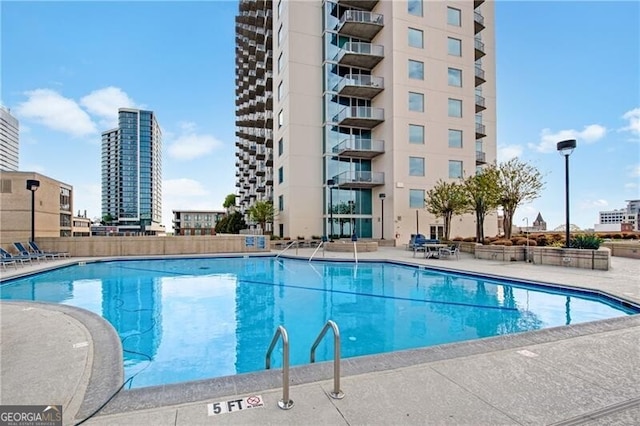 view of swimming pool featuring a patio area