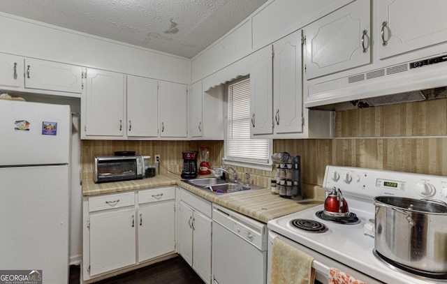 kitchen with white cabinetry, sink, a textured ceiling, and white appliances