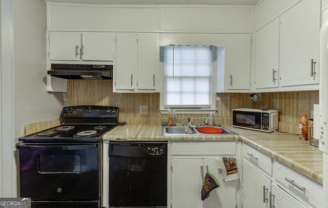 kitchen with white cabinetry, sink, and black appliances