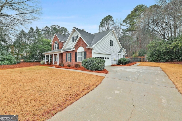 view of front of home featuring a garage and a front yard