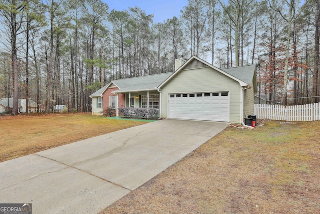 ranch-style house with a garage, covered porch, and a front yard