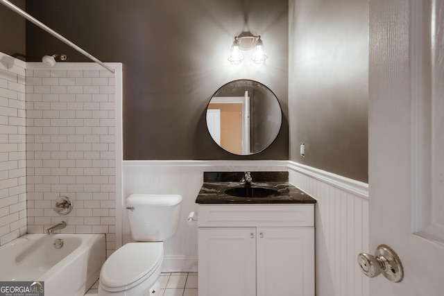 full bathroom with tiled shower / bath, vanity, toilet, and tile patterned flooring