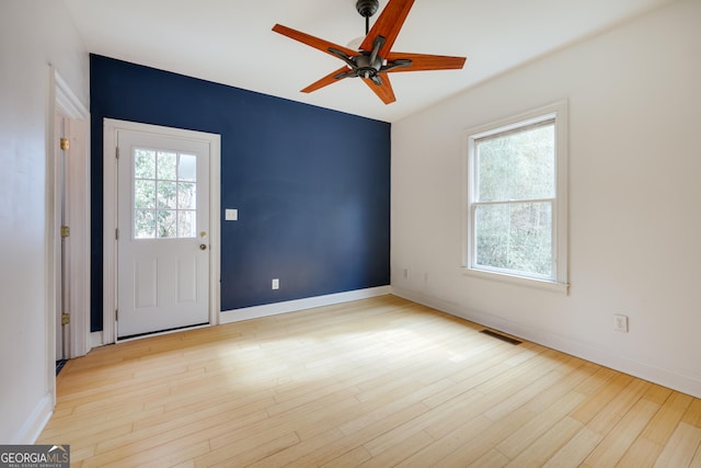 interior space featuring light hardwood / wood-style floors and ceiling fan