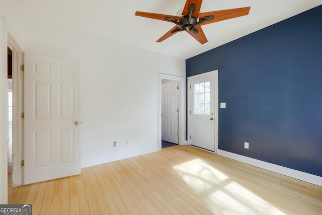 interior space with light hardwood / wood-style flooring and ceiling fan