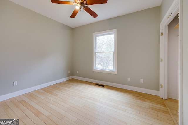 unfurnished room with ceiling fan and light hardwood / wood-style flooring