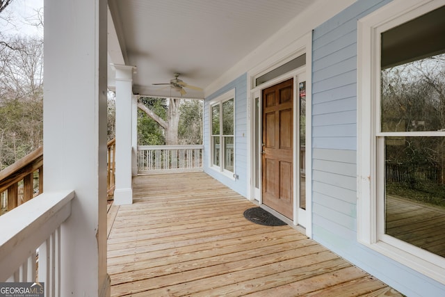 wooden terrace with ceiling fan