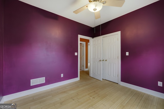 unfurnished room featuring ceiling fan and light wood-type flooring