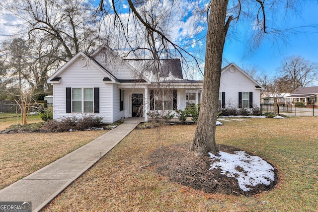 ranch-style home featuring a front yard