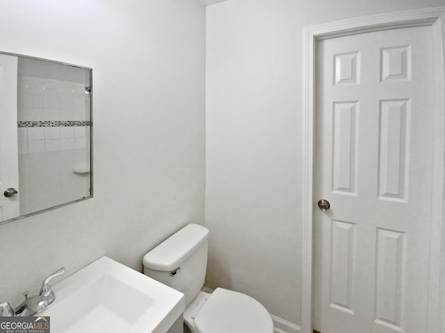 bathroom with toilet and sink